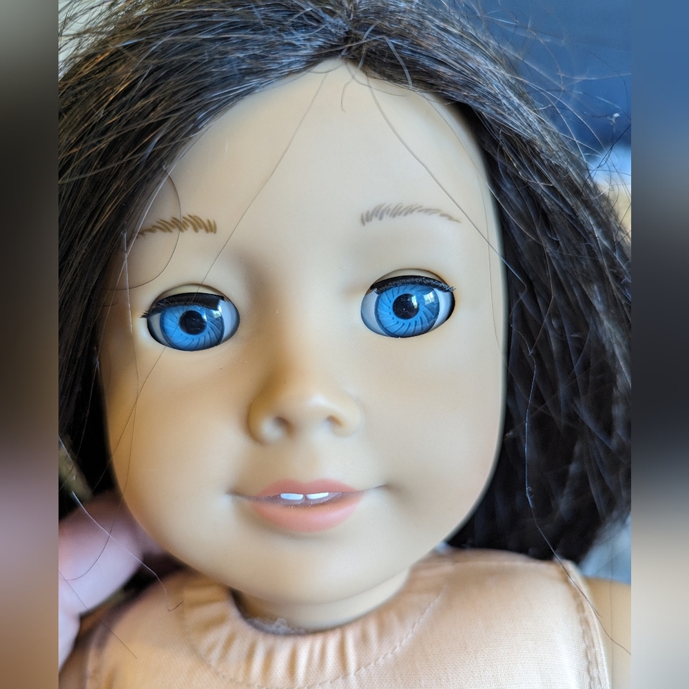American Girl doll with brown hair and blue eyes